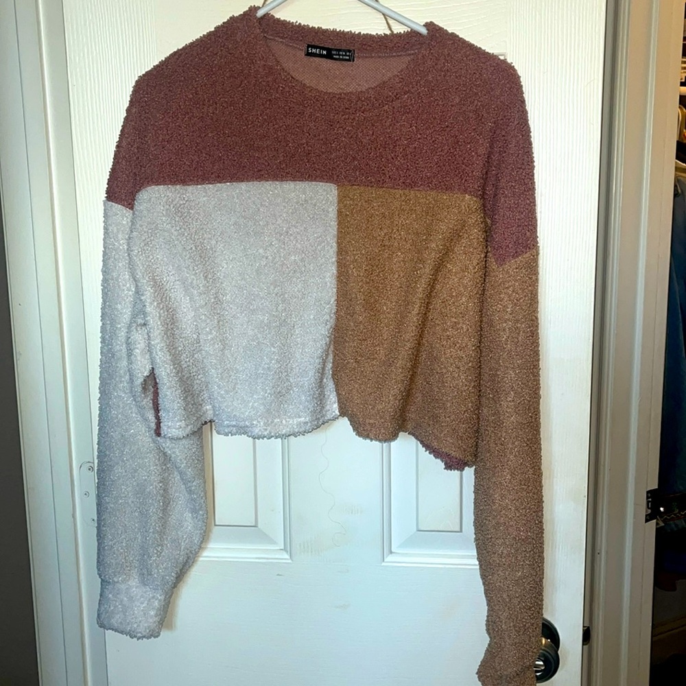 Neutral colored fleece material tank top sweater